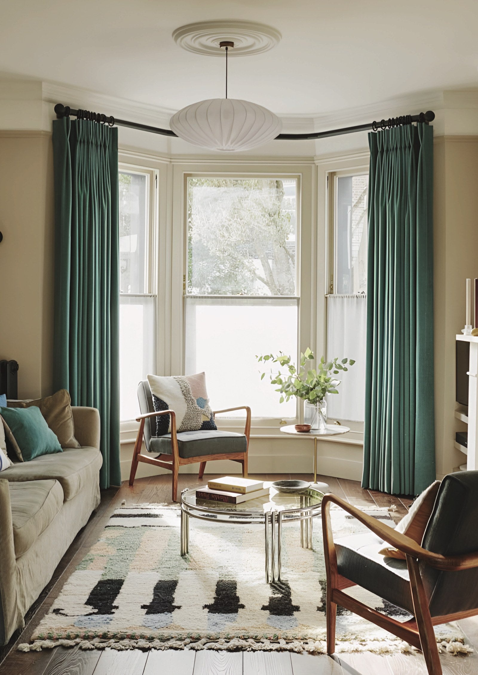 Byron &amp; Byron Metamorph bay window curtain pole in a Victorian bay with green curtains