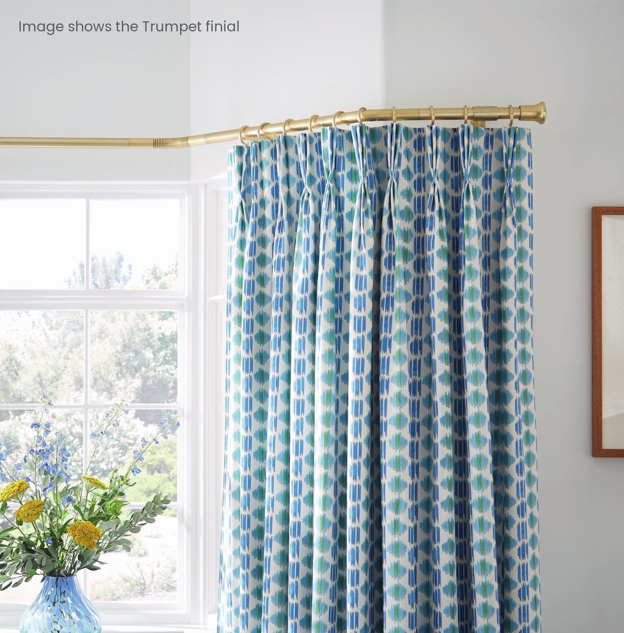Hallis Neo gold bay window pole fitted in a bay (image shows the Trumpet finial)